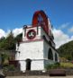 The Laxey Wheel with a blue sky behind