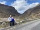 Norman (aka George) and Doreen Lindegaard dtanding arm in arm with a view of the Gap of Dunlow